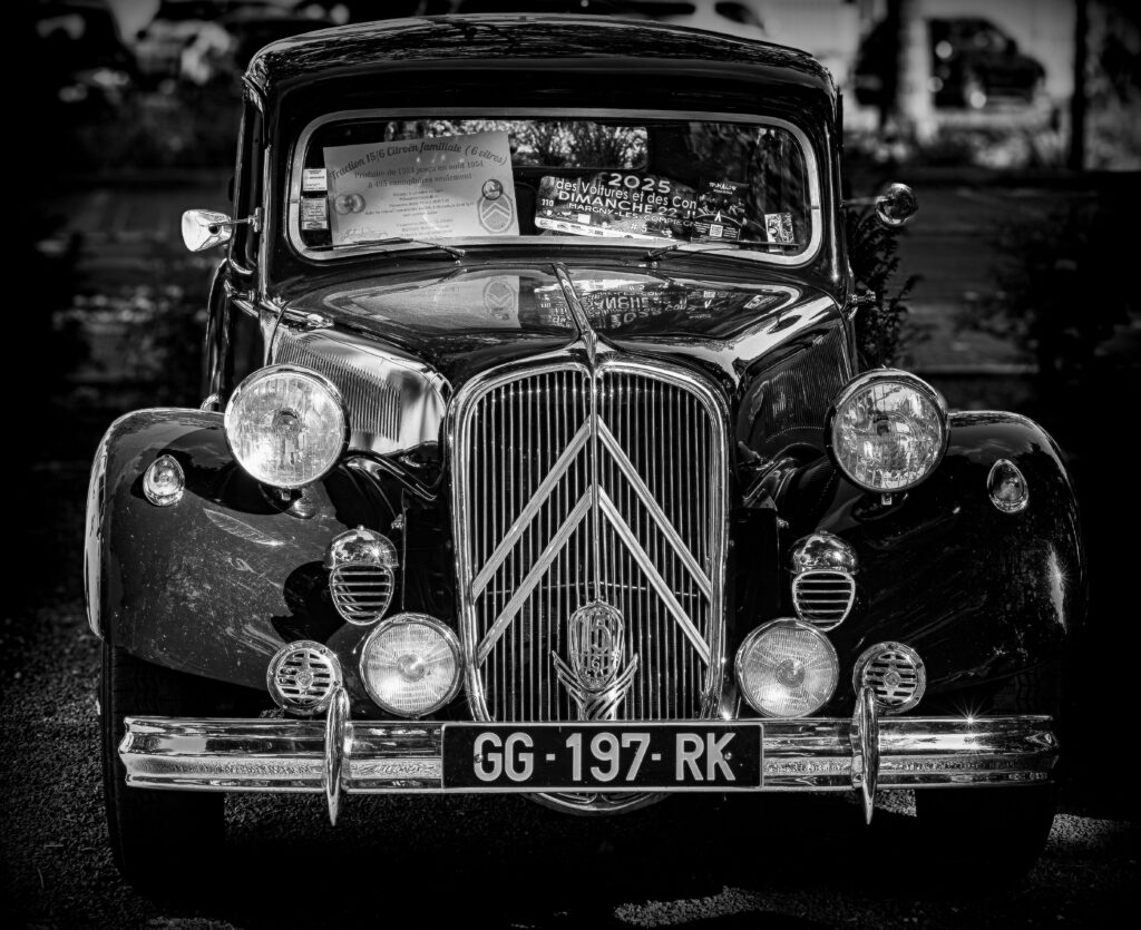 A classic Citroën car showcased in a striking black and white photograph, highlighting its vintage charm.